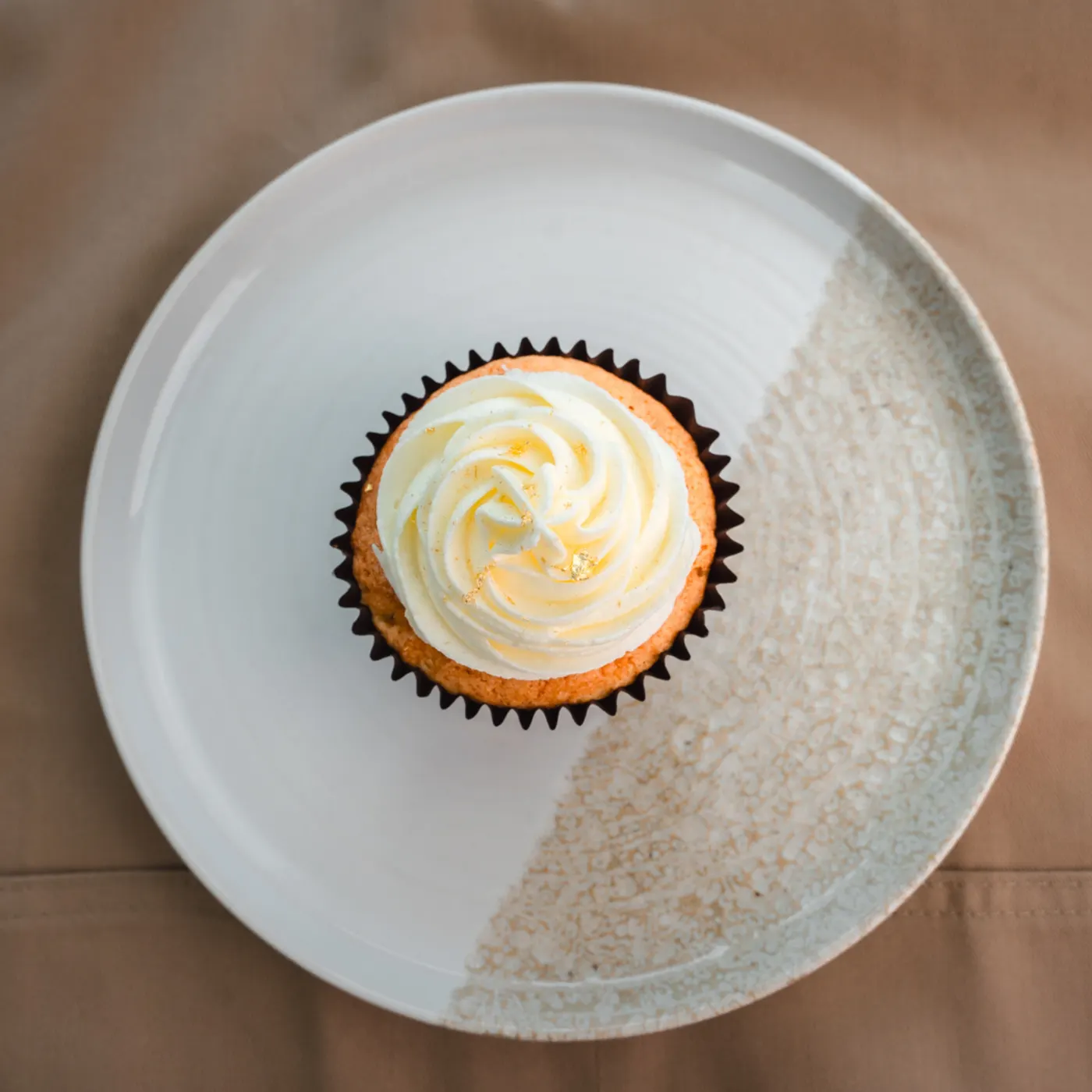 Temporary review photograph of a cupcake. Atmospheric only.